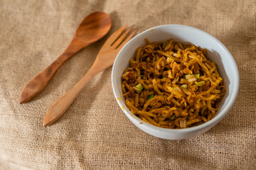 Noodles with vegetables and egg, Asian style cooking.