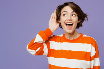 Young curious nosy caucasian woman she wear casual clothes sweatshirt try to hear you overhear...