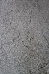 Cracked concrete wall surface, solid soil wall background, cement backdrop