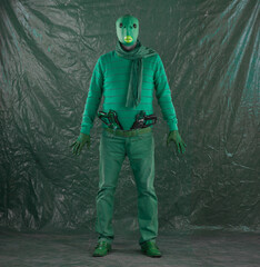 green alien with space weapon