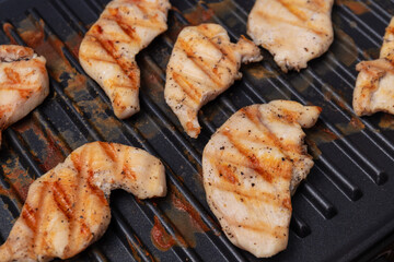 chicken breast cooked on an electric grill. Beautiful grilled chicken	