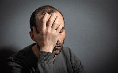 Caucasian stressed man at home.