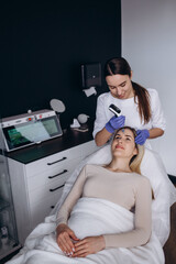 Shot of a beautiful young woman on a facial dermapen micro-needling treatment at the beauty salon