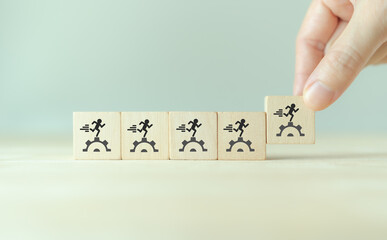 Manpower planning and management concept. Forecasting future staffing needs, analyzing current staffing levels and developing human resource strategies. Wooden blocks with manpower or staffs icons.