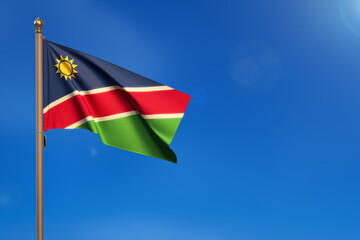 Namibia. Flag blown by the wind with blue sky in the background.