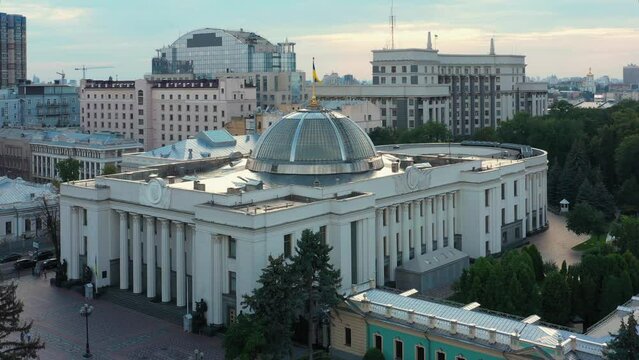 Kiev cityscape with Verkhovna Rada parliament building. Waving ukrainian flag.