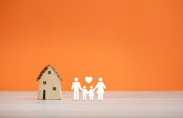 family icon and home model on orange color background