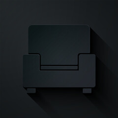 Paper cut Armchair icon isolated on black background. Paper art style. Vector