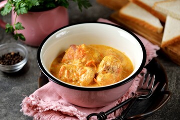 Braised rabbit back in cream with onions and carrots