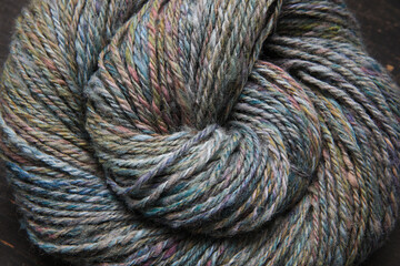 Closeup detail of a colourful skein of organic natural handspun and handdyed alpaca wool yarn...
