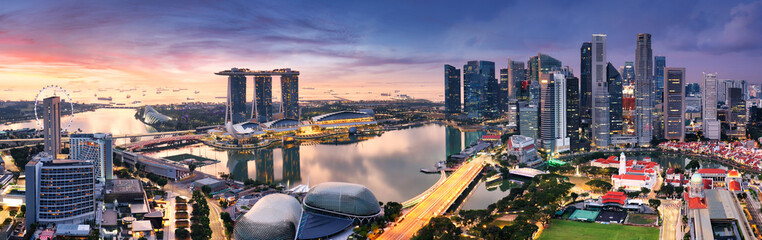Skyscrapers of Singapore skyline at the beautiful sunset, aerial panorama