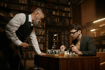 Two pensive chess players looking at chessboard over cozy home interior
