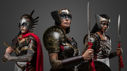 Shot of barbaric warriors women with spears and sword dressed in steel armors.