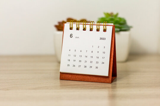June 2023 on the calendar.Desktop calendar for planning on the table.