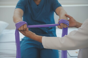 Physiotherapist working with patient in clinic, closeup