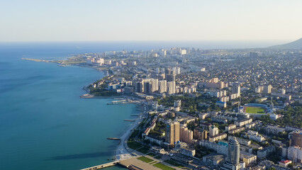 Fototapeta na wymiar Novorossiysk, Russia - September 16, 2020: Panorama of the city and the embankment. Tsemesskaya Bay in the Black Sea, Aerial View