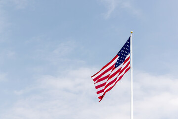 A photo of American flag against the sky
