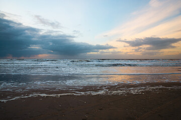 Wadden sea at low tide, North sea beach landscape, coast on Romo island in Denmark at sunset, vacation und lifestyle
