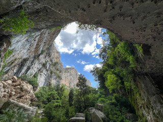  Natural overgrown with lush cave in Spain