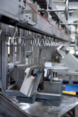 Large poultry farm processing workshop with automated conveyor systems, ensuring high-quality production, efficient packaging, and strict hygiene standards