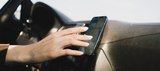 car driver touch smartphone using navigator