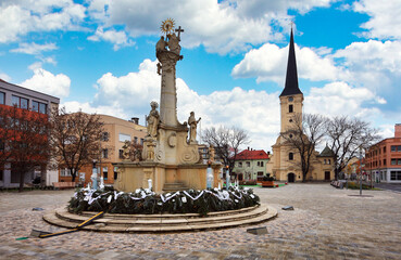 Center of the old town. Holy trinity and Roman Catholic Churchon the city plaza. Main square of city in southern Slovakia. Nove Zamky district. Nitra