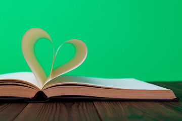 Book pages curved into heart shape