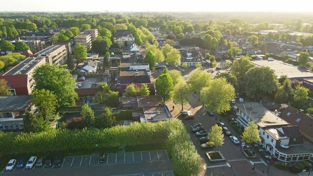 Jib up of a small town center at golden hour in summer