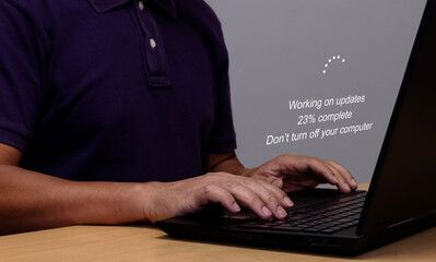 Software update process installation concept Operating system upgrade concept Use a laptop to...