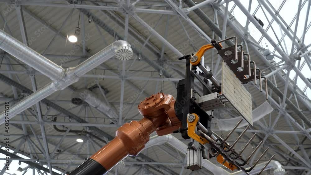 Poster demonstration of an automated robotic technological manipulator loader at the factory