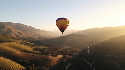 Against the backdrop of a breathtaking valley, a tranquil hot air balloon drifts peacefully through the sky, providing a unique perspective and a sense of freedom. Generated by AI.