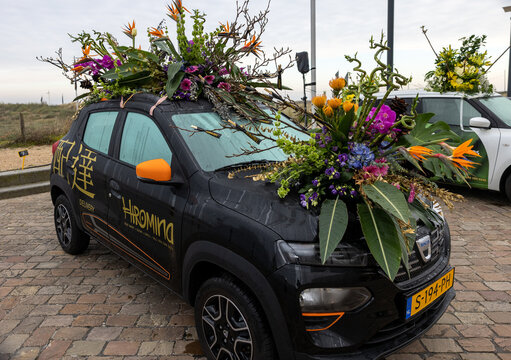 Cars decorated with flowers taking part in the Bloemencorso Bollenstreek the annual spring flower parade from Noordwijk to Haarlem in the Netherlands.