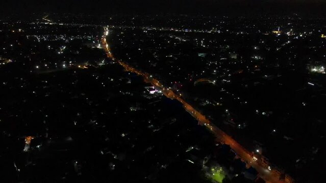 Drone flying over a city in Pakistan during a powercut, and electricity problems in Pakistan