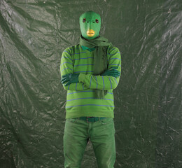 green alien on a green background