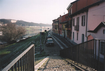 Fototapeta na wymiar Borgo Ticino Village Cityscape on Ticino River. Pavia, Italy. Film Photography