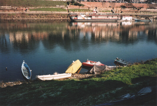 Colorful Canoes and Boats on the Ticino Riverside. Pavia, Italy. Film Photography