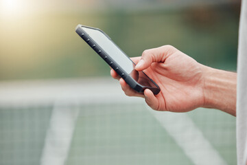 Man, hands and phone on tennis court for social media, communication or networking outdoors....