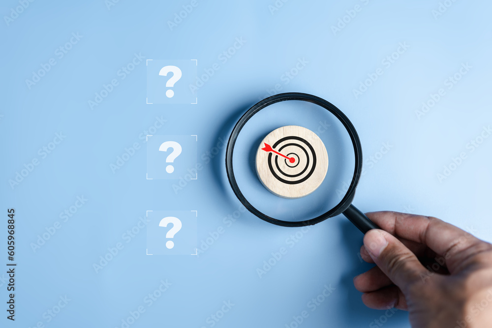 Poster magnifier focus to target solution target which among question icon, successful business and thinkin