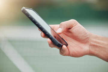 Man, hands and phone on tennis court for communication, social media or networking outdoors....