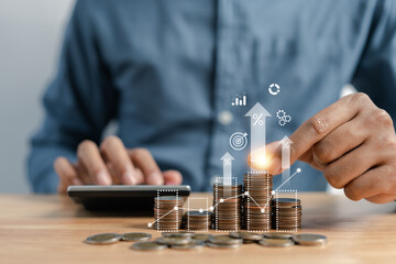 Businessman stacking money coins accounting for increase financial interest rate and business investment growth from dividend, Business Finance and Money, Save money for prepare in the future...