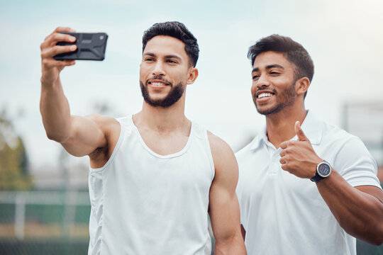 Happy man, friends and tennis selfie for profile picture, social media or online post on court. Athlete men smiling in sport training with thumbs up for photo, memory or vlog in friendship or fitness
