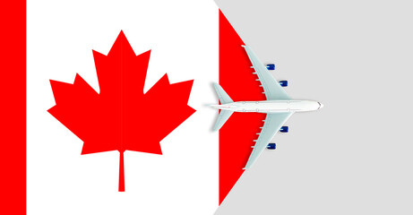 Obraz premium plane model with canadian flag on background, immigration concept