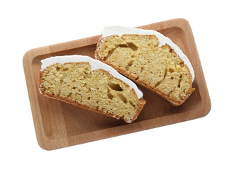 Pieces of homemade yogurt cake with cream on white background, top view