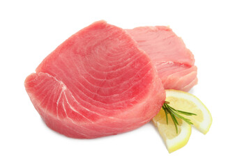 Fresh raw tuna fillets with lemon slices and rosemary on white background