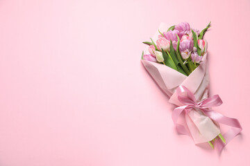 Beautiful bouquet of colorful tulip flowers on pink background, top view. Space for text - obrazy, fototapety, plakaty