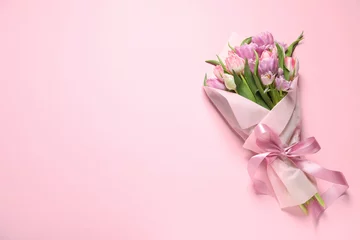 Fotobehang Lengtemeter Beautiful bouquet of colorful tulip flowers on pink background, top view. Space for text