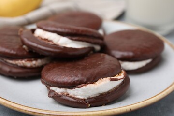 Tasty sweet choco pies on plate, closeup