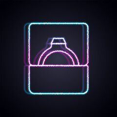 Glowing neon line Diamond engagement ring in box icon isolated on black background. Vector