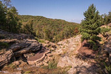 Beautiful view of rocks and trees under a blue sky in Branson, Missouri, United States.