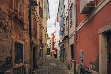 Scenic view of a narrow street with old buildings of an old fisherman town Piran, Slovenia